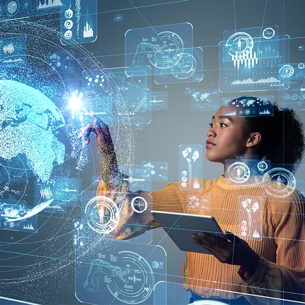 Women holding tablet looking at techy imagery